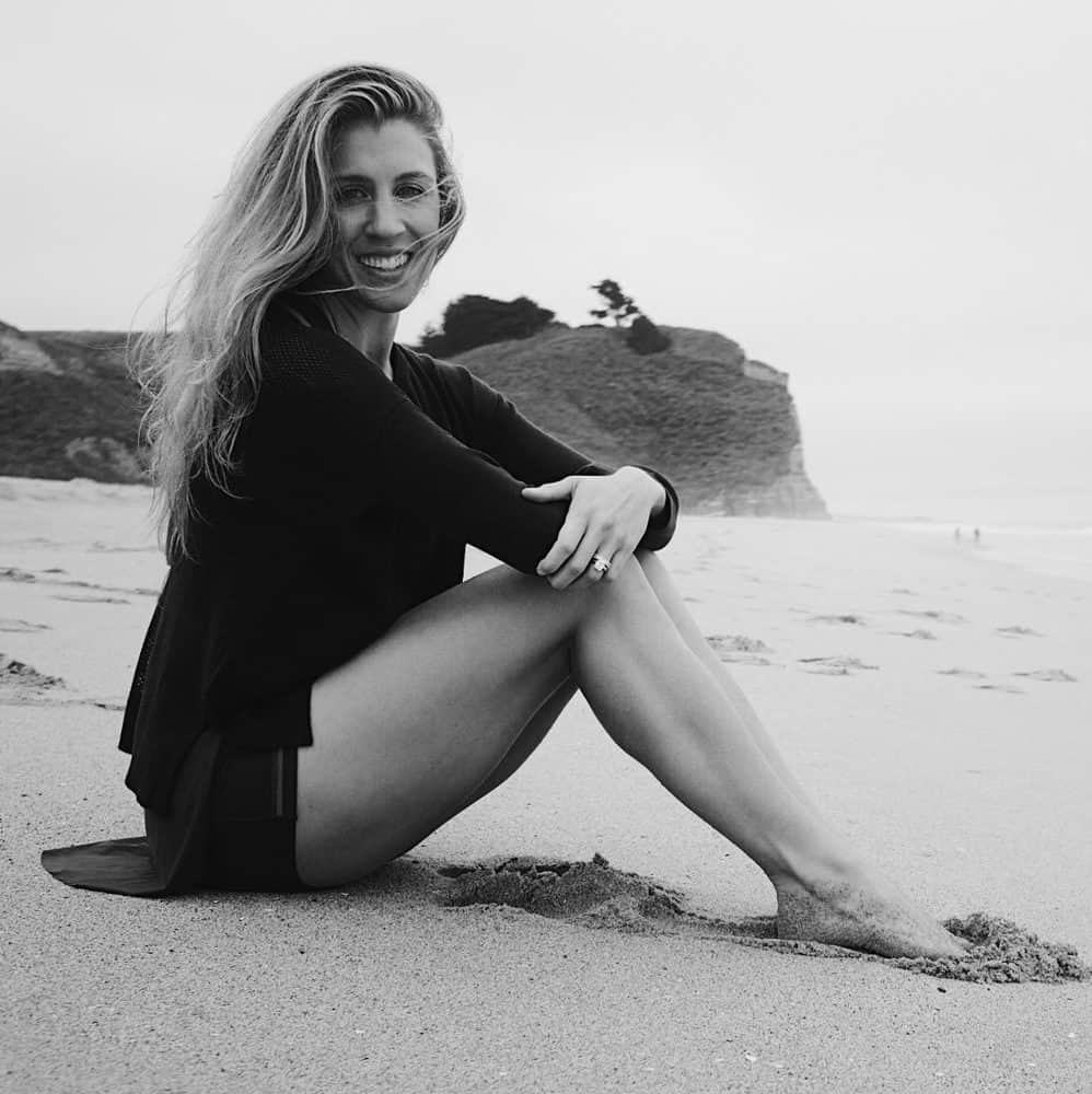 woman sitting on sand