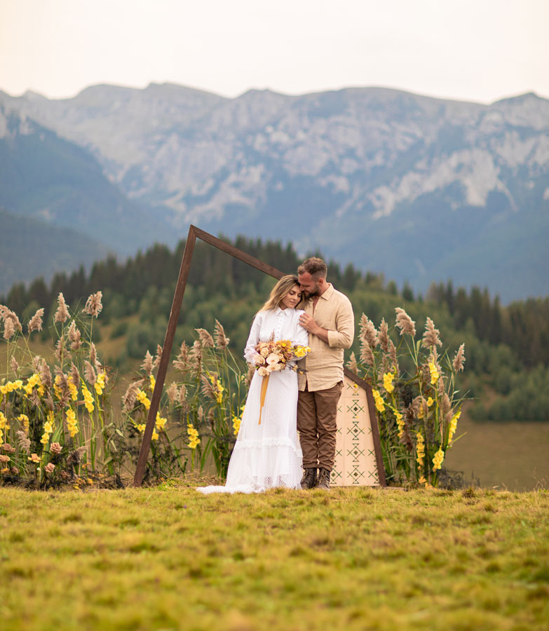 wedding couple standing in front of mountains Tetons in Jackson Hole Wyoming Wedding